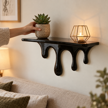 Drip floating shelf holding a plant on a bedroom wall