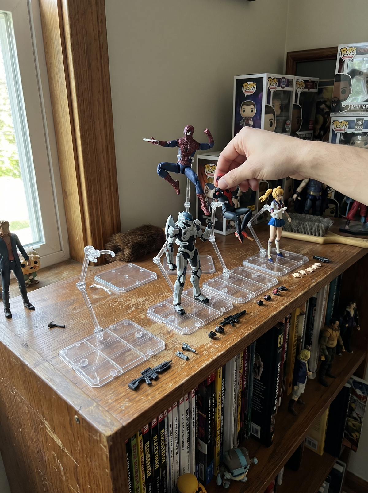 Collector shelf with figures on clear acrylic stands