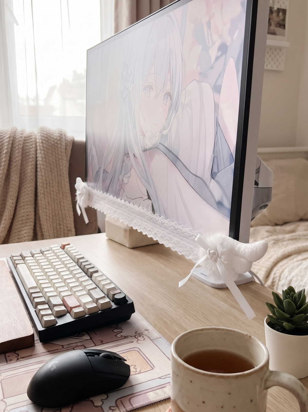 Lace monitor trim with angel wings on a computer screen
